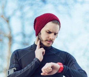 Man checking his heart rate after a run