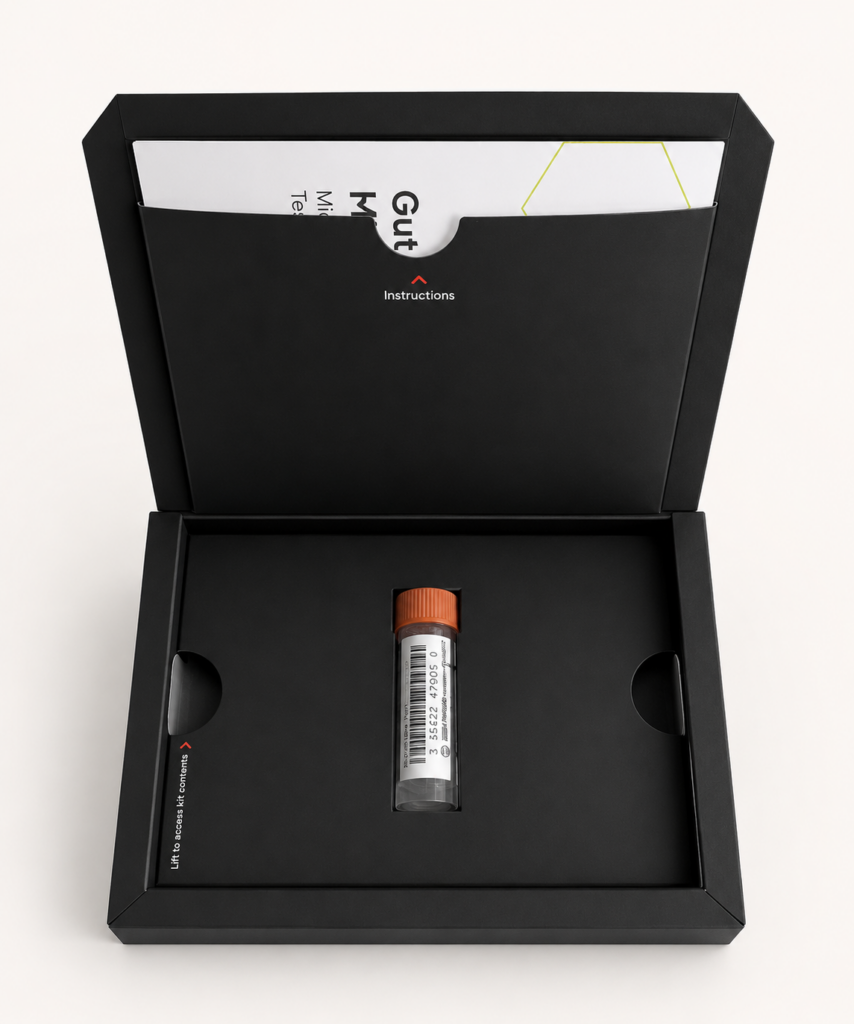 The opened Forth gut microbiome test kit, showing the instructions booklet tucked into the lid pocket and a sealed stool sample collection tube with a barcode label in the inner tray.